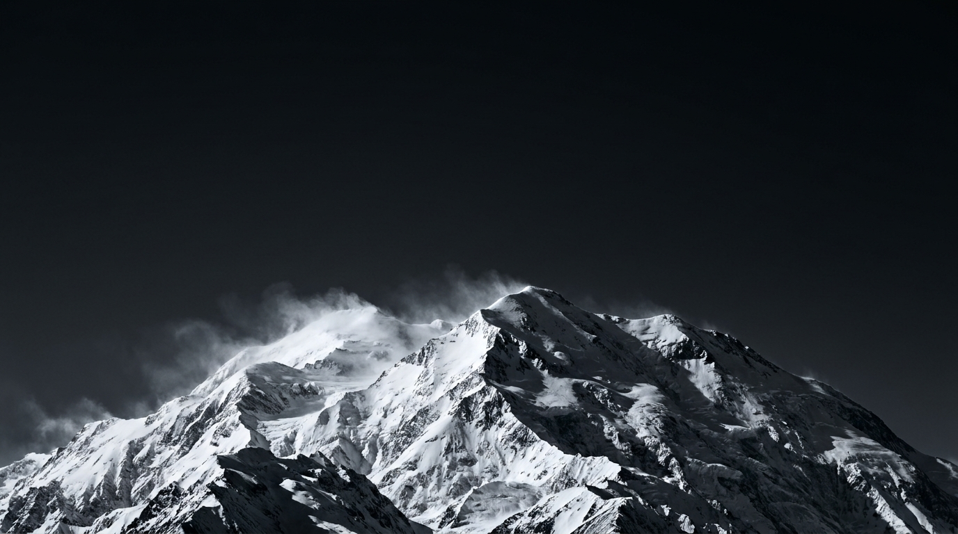 Snow-covered mountain peak in black and white